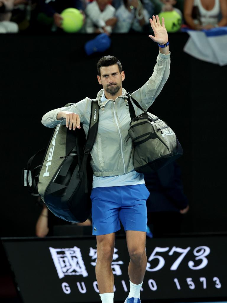 Friends again: Djokovic acknowledges the fans after his win. Picture: Getty