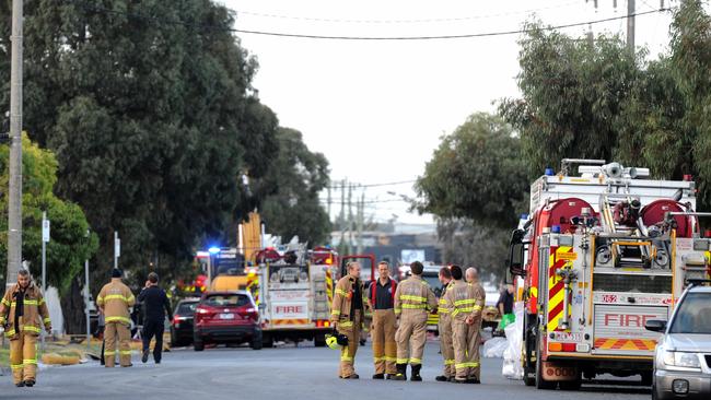 Fire crews mop up at the scene after yesterday's factory fire at Thornycroft Street Campbellfield. Picture: Andrew Henshaw