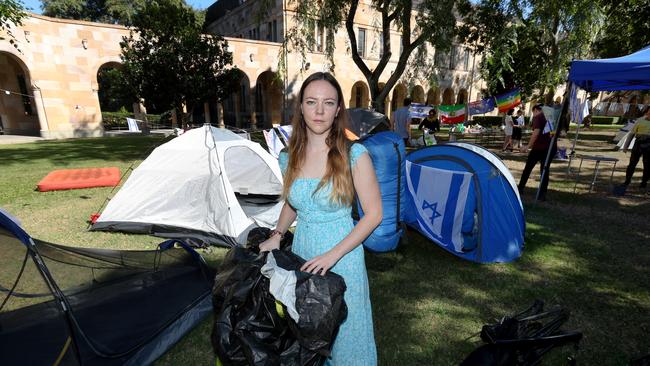 Camp Shalom member Alyssa Peterson packing up the pro-Israel camp on Saturday. Picture: David Clark