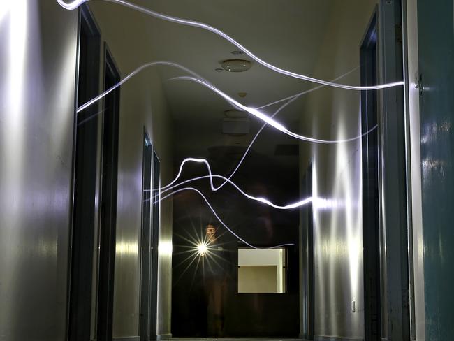 Property maintenance worker Steve Heggs looks through Sanbrook building on Peat Island. Mr Heggs and colleague Sam Bolth had several spooky encounters. Picture: Toby Zerna