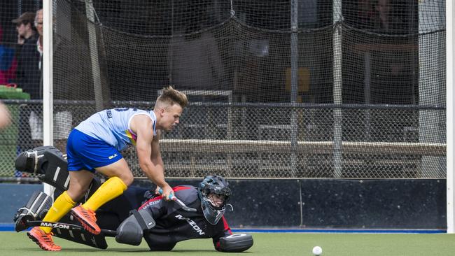 Toowoomba 1 player Carter Mogg and Sunshine Coast keeper Adam Owers in Hockey Queensland Championships at Clyde Park, Sunday, May 2, 2021. Picture: Kevin Farmer