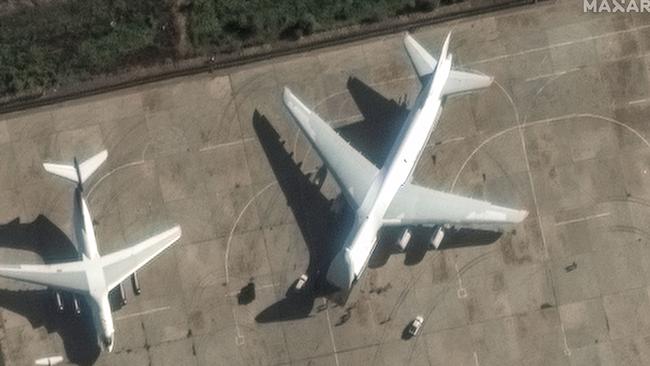 Maxar Technologies satellite imagery shows an Antonov An-124 heavy transport aircraft preparing to load equipment at the Russian Hmeimim Air Base in Syria's western province of Latakia. Picture: Maxar via AFP.