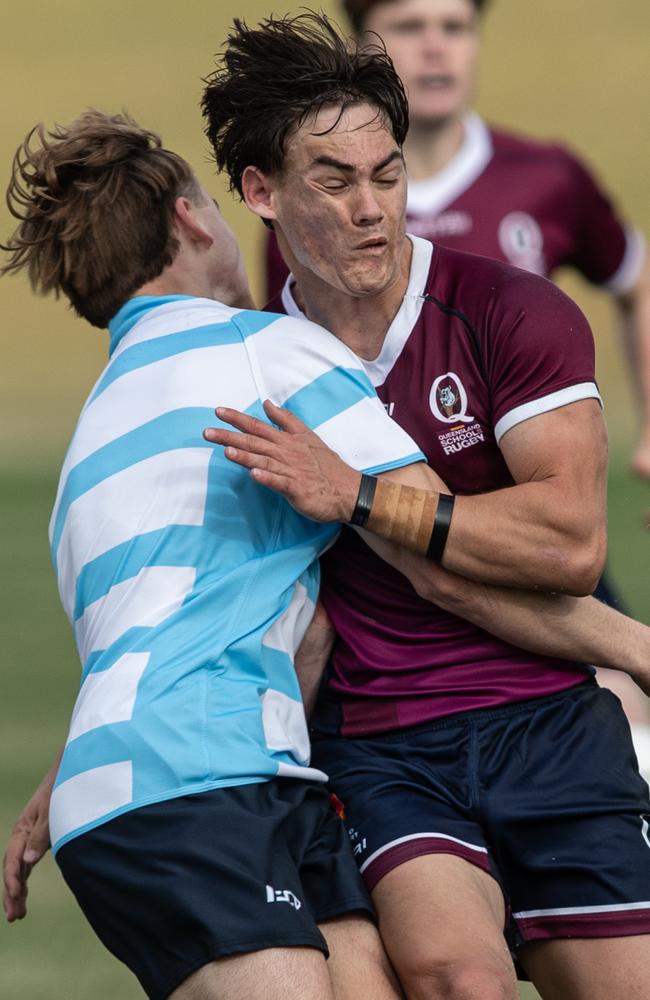 Action from the boys NSW 2 v Queensland 1 game. Queensland’s Sean Weir takes a massive hit. Picture: Julian Andrews