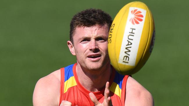 Are you willing to take a punt on Gold Coast defender Pearce Hanley? Picture: AAP Image/Dave Hunt. 