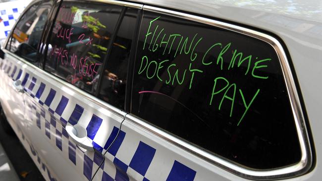 A police car with slogans ahead of the industrial action campaign today. Picture: (AAP/James Ross)