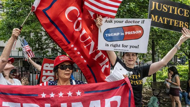 Trump supporters and their opponents spar outside the Manhattan criminal court. Picture: Getty Images via AFP.