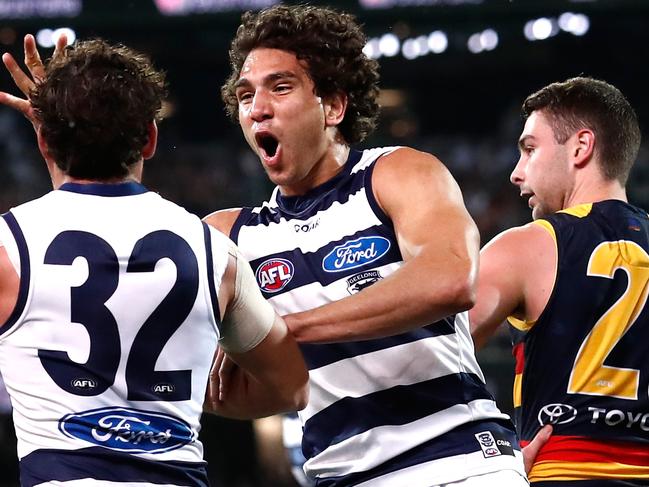 ADELAIDE, AUSTRALIA - SEPTEMBER 22: Nakia Cockatoo of the Cats (middle) celebrates with Steven Motlop of the Cats during the 2017 AFL First Preliminary Final match between the Adelaide Crows and the Geelong Cats at Adelaide Oval on September 22, 2017 in Adelaide, Australia. (Photo by Adam Trafford/AFL Media/Getty Images)