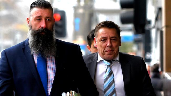 Thompson, right, arrives at the Melbourne Magistrates’ Court with his lawyer. Picture: Nicole Garmston