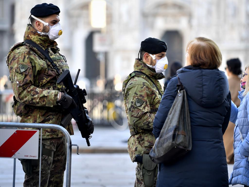 Italian soldiers wearing face masks patrol downtown Milan. Picture: Claudio Furlan/Lapresse via AP