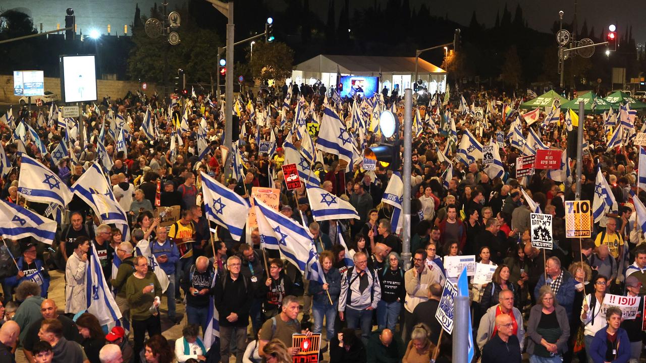 Israelis take to the street in Jerusalem after the dismissal of the defence minister. Picture: AFP