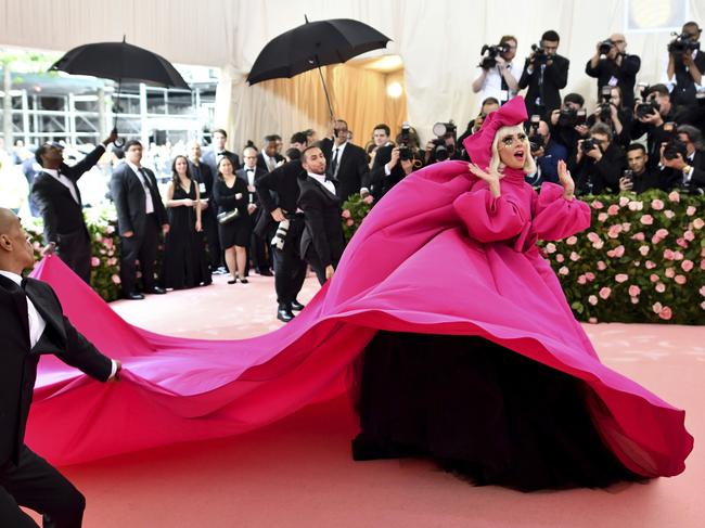 She teased the red carpet with her covered-up pink frock. Picture: AP