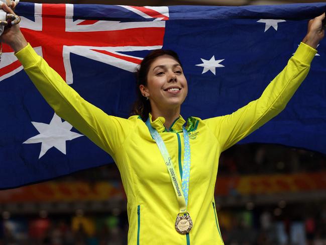 Gold medallist Australia's Georgia Baker celebrates on the podium during the medal presentation ceremony for the women's 25km points race cycling event on day three of the Commonwealth Games, at the Lee Valley VeloPark in east London, on July 31, 2022. (Photo by ADRIAN DENNIS / AFP)