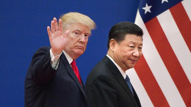 Donald Trump and Xi Jinping leave a business leaders event at the Great Hall of the People in Beijing in 2017.