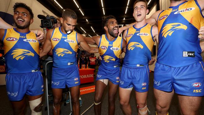 An injured Liam Ryan (centre) celebrates the Eagles win. Pic: Getty Images