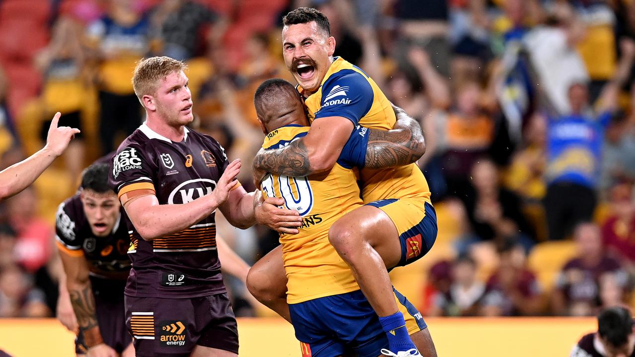 Reagan Campbell-Gillard celebrates with Junior Paulo after a try against the Broncos. Picture: Bradley Kanaris/Getty Images