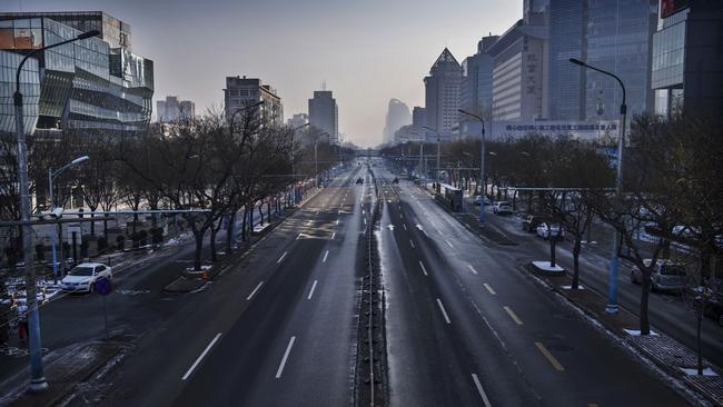 A nearly empty street in a usually bustling shopping district in Beijing. Picture: Getty Images