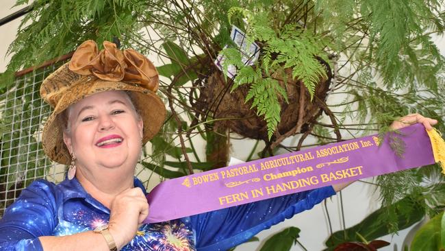 Fiona Radcliffe with her Champion Hanging Basket – a haresfoot fern she 'rescued' from her mother's garden. Picture: Kirra Grimes