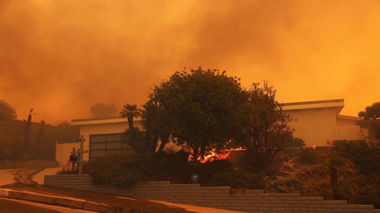 A brush fire burns near homes in Pacific Palisades, California. Picture: AFP