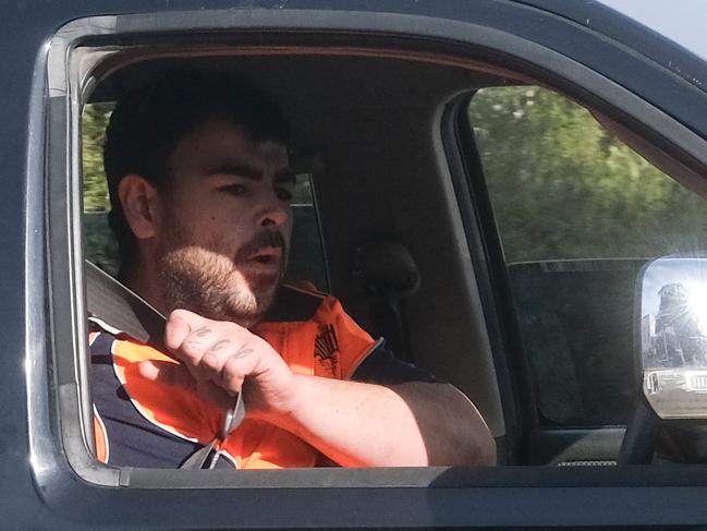 A man believed to be Brandon Juresko drives away from a conflict in Geelong's CBD on July 23. Juresko is currently banned from driving after losing his licence for four years when he left another man for dead.