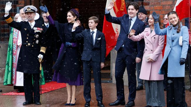 King Frederik X and Queen Mary of Denmark wave to onlookers as they arrive with their children Crown Prince Christian, Princess Isabella, Princess Josephine and Prince Vincent. Picture: AFP