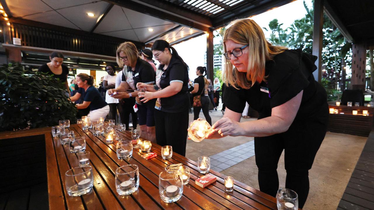 A candlelit vigil to remember and honour those lost to domestic and family violence was held at Wharf One Cafe. Relationships Australia regional manager Alisha Lyncoln lights a candle to remember those lost. Picture: Brendan Radke