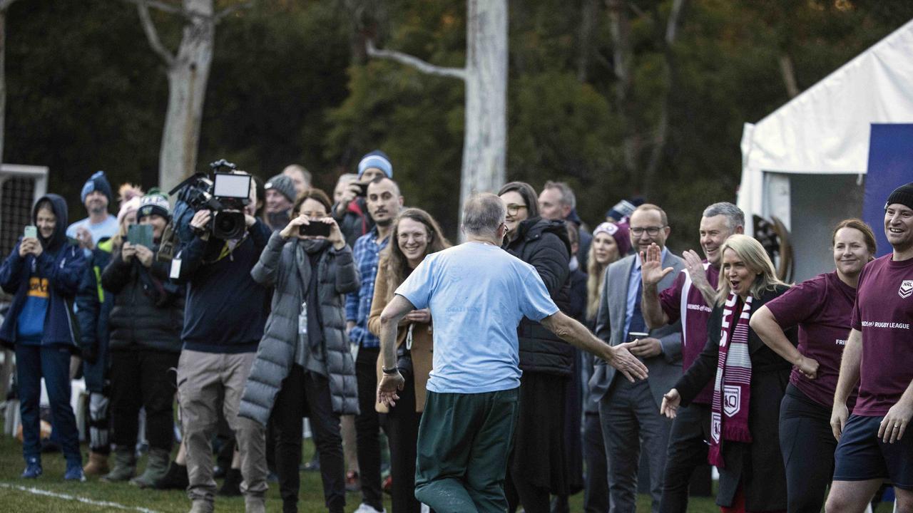 The Prime Minister takes high fives from the crowd after his try. Picture: NCA NewsWire / Gary Ramage