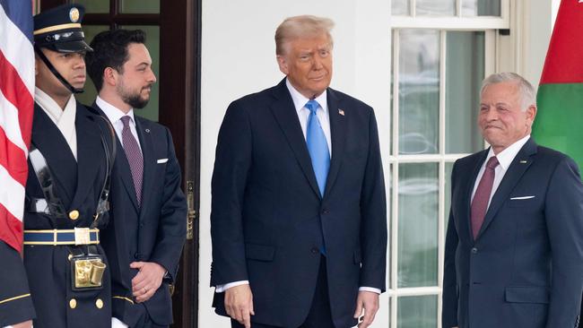 Donald Trump greets Jordan’s King Abdullah II (R) and Crown Prince Hussein (L) as they arrive for a meeting at the West Wing of the White House. Picture: AFP.