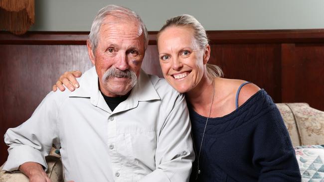 Rugby referee Peter Woods at home this week with his daughter Alex. Picture: Jonathan Ng