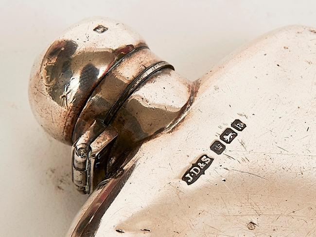 Auction of Bob Hawke & Blanche d'Alpuget Mementos Curiosities Art and Design: Sterling Silver Whiskey Flask Mark of J. D. & S., Sheffield monogrammed ‘B H’, hallmarked, together with a silver plated, leather and glass flask (2). Picture: Supplied