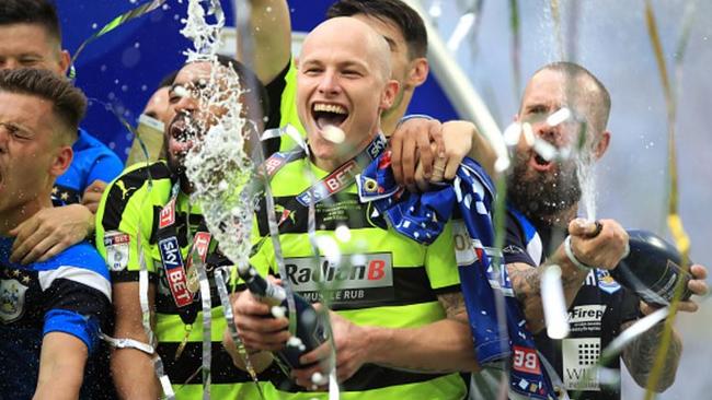 Aaron Mooy celebrates Huddersfield's Premier League promotion