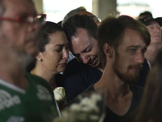 People pay tribute to journalists killed in the plane crash after it ran out of fuel. Picture: Douglas Magno/AP