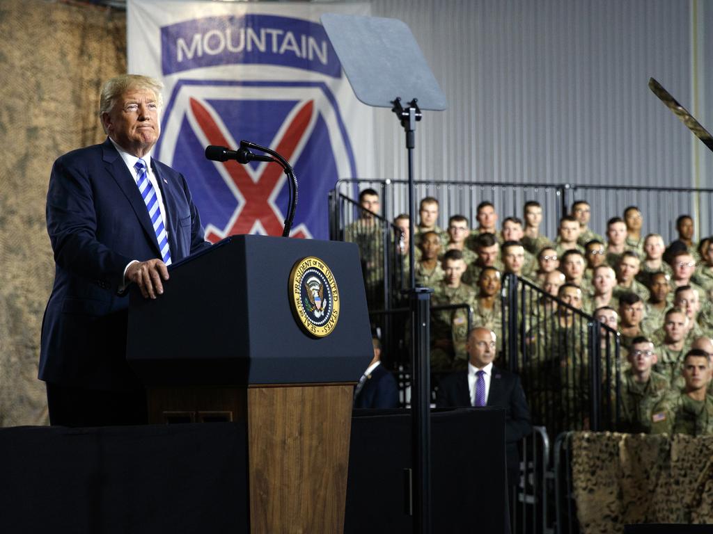 President Donald Trump pauses as he speaks before signing a $716 billion defence policy bill named for John McCain in Fort Drum. Picture: AP