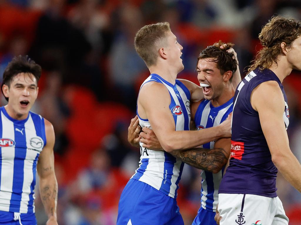 Powell celebrates a goal with Jy Simpkin. Picture: Dylan Burns/AFL Photos