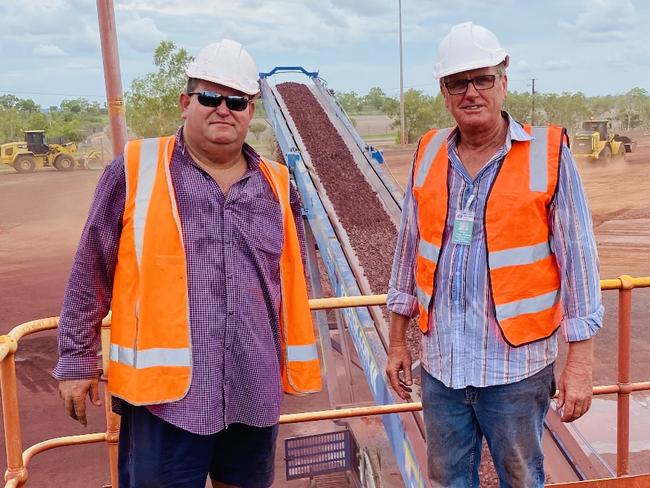 NT Bullion joint partners Roy Jansan, left, and Managing Director Rod Illingworth supervise the loading of iron ore from France Creek aboard the Clipper Panorama. Picture: Supplied