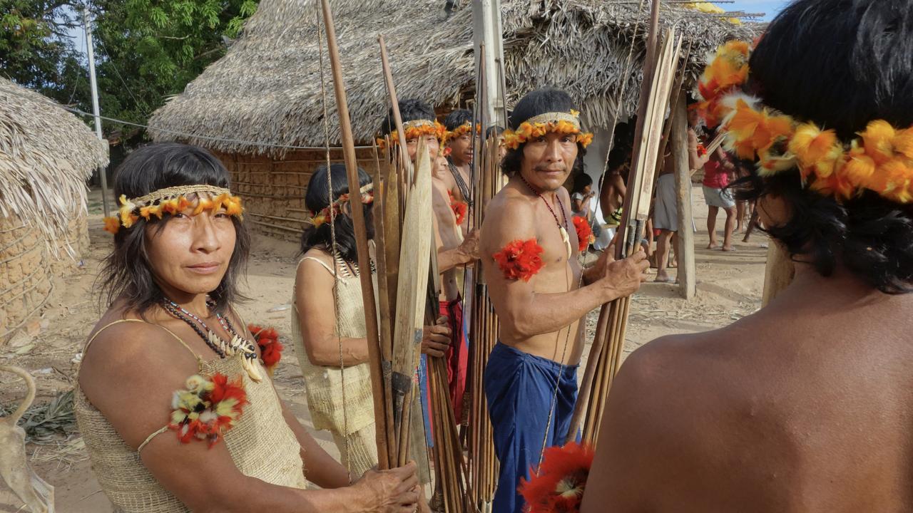 Awa men and women prepare to go hunting in their village in the Caru Indigenous Territory, Brazil, in 2017. The Awa, some of whom remain uncontacted, are considered one of the most endangered indigenous tribes in the world. Picture: Scott Wallace/Getty Images