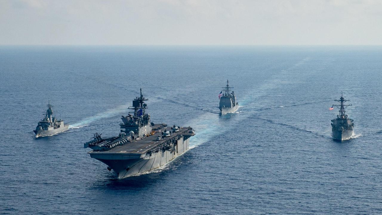 HMAS Parramatta conducts joint manoeuvres with USS America, USS Bunker Hill and USS Barry in the South China Sea. Picture: Department of Defence