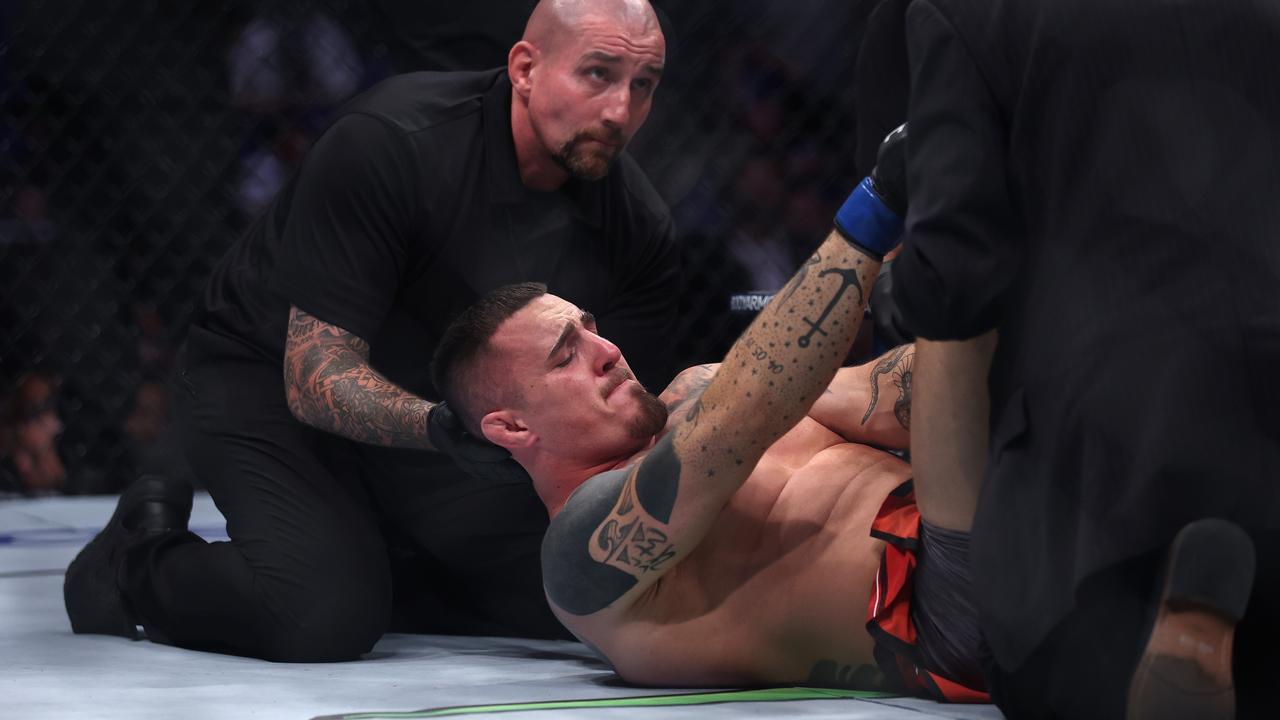 LONDON, ENGLAND - JULY 23: Tom Aspinall of England gets injured in the first round of his Heavyweight bout against Curtis Blaydes of USA during UFC Fight Night at O2 Arena on July 23, 2022 in London, England. (Photo by Julian Finney/Getty Images)
