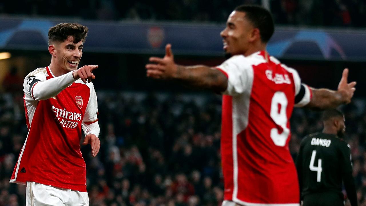 Arsenal's German midfielder #29 Kai Havertz (L) celebrates scoring his team's first goal during the UEFA Champions League Group B football match between Arsenal and RC Lens at the Arsenal Stadium in north London on November 29, 2023. (Photo by Ian Kington / AFP)