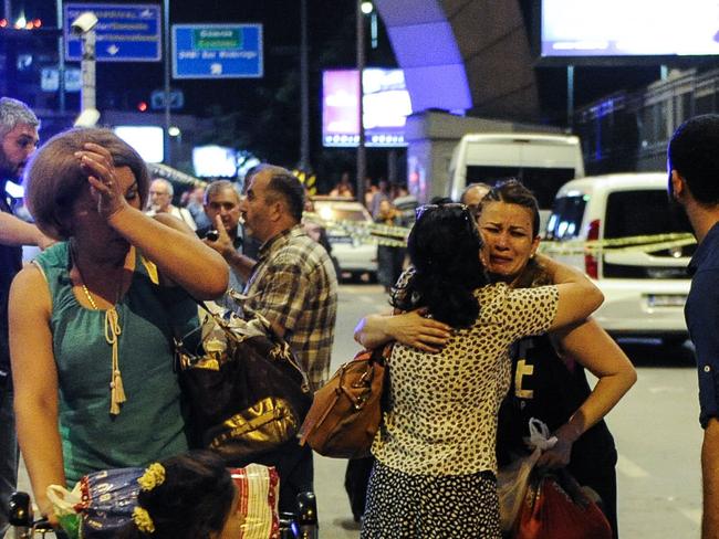 Passengers who survived from the suicide bomb attack cry as they leave Turkey's largest airport. Picture: Getty Images