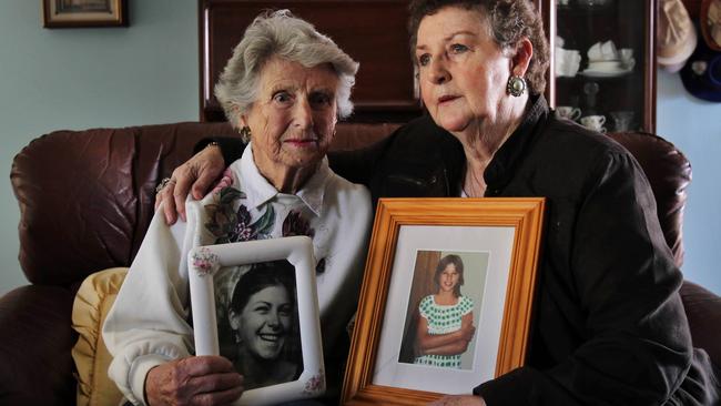 Beth Leen, 83, with a photo of her daughter Leanne Goodall who went missing aged 20 years in 1978, with Anne Robinson who holds a photo of her daughter Amanda Robinson who went missing aged 14 years in 1979.