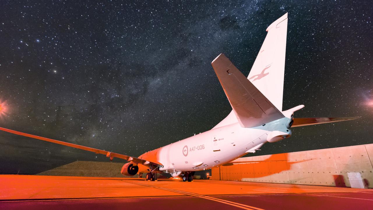 An RAAF No. 11 Squadron P-8A Poseidon sits on the hardstand at RAAF Base Learmonth after mission about Cocos, Keeling, Norfolk, Heard, Macquarie and Lord Howe Islands.