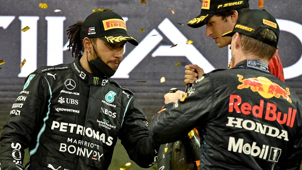 No hard feelings. Lewis Hamilton congratulates Verstappen after his big win.