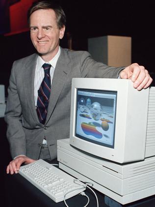 John Sculley, chairman of Apple, shows off the new Macintosh II computer in 1997. Picture: AP