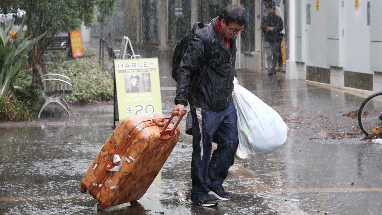 Residents were escorted in and out of Mascot Towers to collect personal belongings. Picture: David Swift.