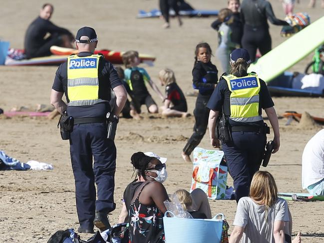 Police and ADF were on combined patrols of Ocean Grove beach on Saturday. The car parks were summer-like full. Picture: Alan Barber