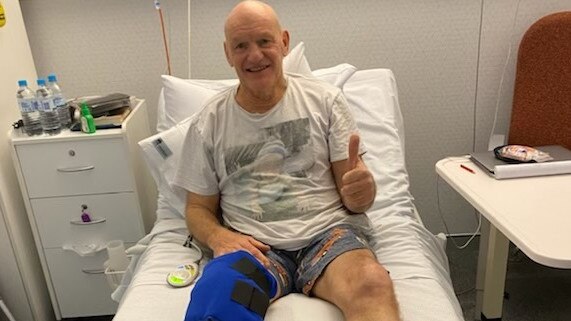 Peter Wynn gives the thumbs up after his knee replacement surgery.