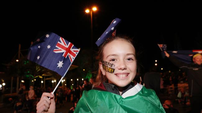 12 year old Mikalah Dill celebrates at Kings Beach as Brisbane is announced as the host of the 2032 Olympic Games. Picture Lachie Millard