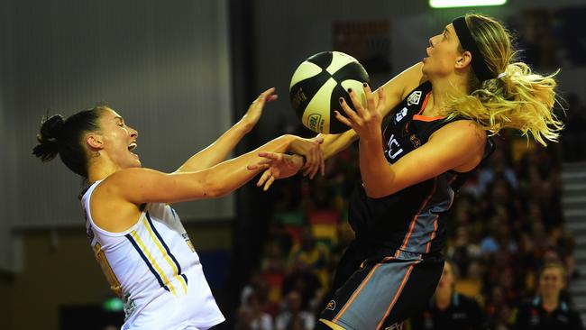 Sydney Uni Flames' Katie-Rae Ebzery, left, feels the force of Townsville Fire's Sydney Wiese. Picture: Evan Morgan