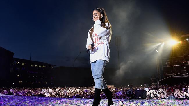 Grande wipes away a tear as she performs on stage during the One Love Manchester Benefit Concert. Picture: Getty