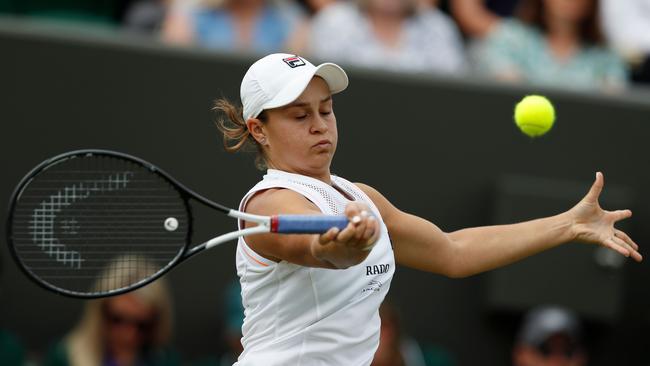 Ash Barty returns against Alison Riske during their women's singles fourth round match. Picture: Adrian Dennis/AFP